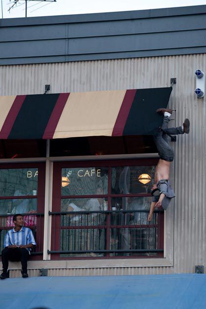 This guy was hanging upside down and fell onto the lower awning